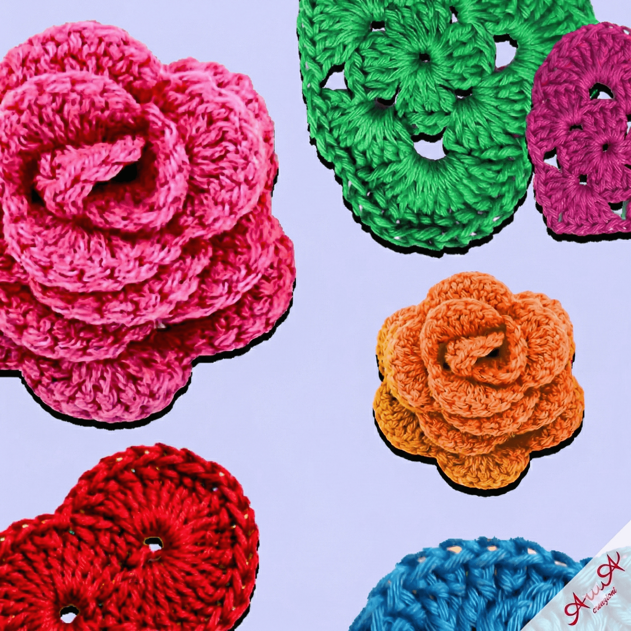 Vibrant pink and orange crocheted roses with colorful circular motifs on a light purple background.